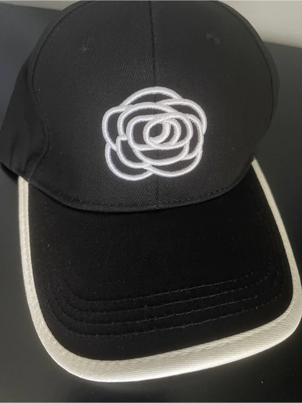 Fun Fashion New Cap Black w/white embroidered Camilla flower/Adjustable